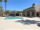 Community pool with resort-style pool with lounge chairs and landscaping at 5383 Indian River Dr # 327, Las Vegas, NV 89103