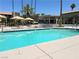 Community pool featuring resort-style pool with lounge chairs and landscaping at 5383 Indian River Dr # 327, Las Vegas, NV 89103