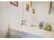 Bathroom with a white vanity, framed mirror and decorative soap dispensers at 5706 W Lake Mead Blvd, Las Vegas, NV 89108