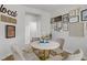 Bright dining area features a round table, stylish chairs, and decorative wall art, perfect for casual meals at 5742 Shadow Bend Dr, Las Vegas, NV 89135