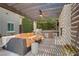 Outdoor living area showcases a built-in grill, fireplace, and comfortable seating under a shaded pergola at 5742 Shadow Bend Dr, Las Vegas, NV 89135