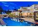Beautiful nighttime view of the home and backyard, featuring a sparkling pool at 60 Innisbrook Ave, Las Vegas, NV 89113