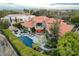 Aerial shot features a backyard oasis with a pool, cabana, outdoor seating, and immaculate landscaping at 60 Innisbrook Ave, Las Vegas, NV 89113