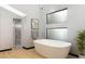 Modern bathroom with freestanding tub and walk-in shower at 60 Innisbrook Ave, Las Vegas, NV 89113