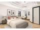 Bright bedroom showcasing modern lighting and sitting area with view at 60 Innisbrook Ave, Las Vegas, NV 89113