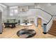 Bright foyer features soaring ceilings, curved staircase, and ample natural light at 60 Innisbrook Ave, Las Vegas, NV 89113