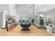 Bright living room features a bar, billiards table, and large windows at 60 Innisbrook Ave, Las Vegas, NV 89113