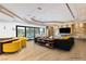 Living room featuring a fireplace, lounge area, and large windows at 60 Innisbrook Ave, Las Vegas, NV 89113