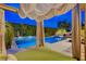 A luxurious poolside cabana overlooking a sparkling pool and outdoor lounge area at 60 Innisbrook Ave, Las Vegas, NV 89113
