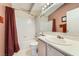Standard bathroom with combined tub and shower, single vanity, and neutral finishes at 605 Devonhall St # 201, Las Vegas, NV 89145