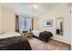 Cozy bedroom with two twin beds, neutral walls and carpet and a ceiling fan at 605 Devonhall St # 201, Las Vegas, NV 89145
