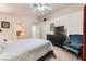 Bright bedroom featuring neutral walls, ceiling fan, carpet and comfortable armchair at 605 Devonhall St # 201, Las Vegas, NV 89145
