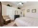 Neutral bedroom with ceiling fan, traditional furniture and decorative plants on the ledge at 605 Devonhall St # 201, Las Vegas, NV 89145