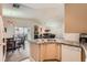 Open-concept kitchen flowing into the living and dining areas, perfect for entertaining at 605 Devonhall St # 201, Las Vegas, NV 89145