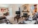 Inviting living room with fireplace, seamlessly connecting to the dining area at 605 Devonhall St # 201, Las Vegas, NV 89145