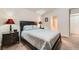 Relaxing main bedroom with neutral walls, a ceiling fan, and ensuite bathroom entrance at 605 Devonhall St # 201, Las Vegas, NV 89145