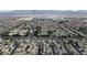 Aerial view of a residential community near a desert landscape with mountain views at 6325 Orions Tool St, North Las Vegas, NV 89031