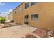 The backyard shows a concrete patio with brick edging and a view of the home's exterior at 6325 Orions Tool St, North Las Vegas, NV 89031