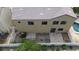 Aerial view of the home's rear exterior showing fencing, landscaping, and a swimming pool at 6325 Orions Tool St, North Las Vegas, NV 89031