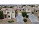 Two-story homes featuring desert landscaping and private driveways in a Gathering-friendly community at 6325 Orions Tool St, North Las Vegas, NV 89031