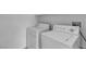 Laundry room with washer and dryer units against a white wall at 6325 Orions Tool St, North Las Vegas, NV 89031