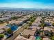 An aerial view of a desert neighborhood with single-Gathering homes with desert landscaping at 669 Elliot Peak Ave, Las Vegas, NV 89183