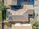 Aerial view of a well-maintained single-story home, featuring a tile roof and desert landscaping at 669 Elliot Peak Ave, Las Vegas, NV 89183