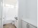 Well-lit bathroom featuring a shower-tub combo and a modern vanity at 669 Elliot Peak Ave, Las Vegas, NV 89183