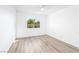 Minimalist bedroom featuring a window and wood-style flooring at 669 Elliot Peak Ave, Las Vegas, NV 89183