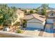 Well-maintained single-Gathering home with desert landscaping and a two-car garage at 669 Elliot Peak Ave, Las Vegas, NV 89183