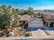 Charming single-Gathering home with manicured desert landscaping and a two-car garage at 669 Elliot Peak Ave, Las Vegas, NV 89183