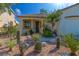 Attractive home with desert landscaping, dark trim window, and a stylish front door at 669 Elliot Peak Ave, Las Vegas, NV 89183