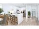 Modern kitchen featuring white cabinets, stainless steel appliances, quartz countertops, and eat in bar at 669 Elliot Peak Ave, Las Vegas, NV 89183