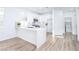 Well-lit kitchen with stainless steel appliances, quartz countertops, and a breakfast bar at 669 Elliot Peak Ave, Las Vegas, NV 89183