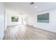 Bright and spacious living room with wood flooring, ample natural light, and neutral paint at 669 Elliot Peak Ave, Las Vegas, NV 89183