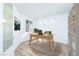 Bright office featuring a hardwood desk, large window, and shelving at 669 Elliot Peak Ave, Las Vegas, NV 89183