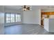 Open concept living area that flows into the kitchen, featuring sleek flooring at 7151 S Durango Dr # 211, Las Vegas, NV 89113