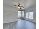 Bright living area with gray flooring, a sliding door, and large window with plenty of light at 7151 S Durango Dr # 211, Las Vegas, NV 89113