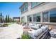 Cozy backyard seating area with comfortable outdoor furniture, a fire pit, and lush greenery, ideal for relaxation at 7538 Mustang St, Las Vegas, NV 89131