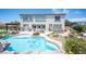 Backyard oasis with a sparkling pool, lush landscaping, outdoor kitchen and seating, creating the perfect retreat at 7538 Mustang St, Las Vegas, NV 89131