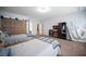 Bedroom with two beds featuring a hanging chair, a closet, a dresser, and plenty of space at 7538 Mustang St, Las Vegas, NV 89131