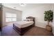 Bright bedroom features modern furniture, neutral paint, large windows, and plush carpet at 7538 Mustang St, Las Vegas, NV 89131