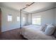 Well-lit bedroom with a four poster bed, neutral walls and plenty of natural light from multiple windows at 7538 Mustang St, Las Vegas, NV 89131