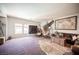 Spacious bonus room features large windows, modern decor, and a comfortable leather sofa for relaxing at 7538 Mustang St, Las Vegas, NV 89131