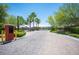 Gated entrance to the community with a brick paved driveway and lush landscaping for a grand entrance at 7538 Mustang St, Las Vegas, NV 89131