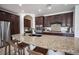 Close up of the kitchen island, featuring granite countertops and stainless steel appliances at 7538 Mustang St, Las Vegas, NV 89131