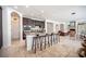 Spacious kitchen featuring a large island with seating, stainless steel appliances, and dark wood cabinets at 7538 Mustang St, Las Vegas, NV 89131