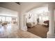 Elegant living room featuring travertine floors, decorative columns, arched doorways, and a cozy seating area at 7538 Mustang St, Las Vegas, NV 89131