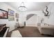 Elegant living room featuring a piano, staircase, and stylish decor at 7538 Mustang St, Las Vegas, NV 89131