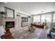 Inviting living room features a fireplace, modern furniture, large windows, and stylish decor at 7538 Mustang St, Las Vegas, NV 89131